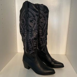 Tall black cowboy boots